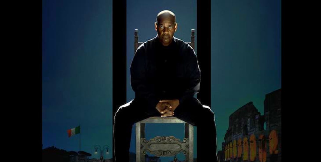 Denzel Washington sitting on chair poster Read 